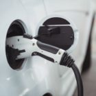 Close-up of car being charged with electric car charger