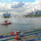An FDNY Fire Tender sprays its hoses in the Hudson River after the race