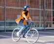 2 Swytch eBike Conversion Kit – Action Shot of Lady Riding Swytch Bike