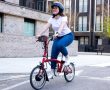 Swytch eBike Conversion Kit – Women Riding side on Swytch Bike.dng